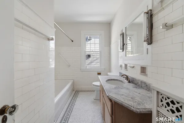 a bathroom with a bath tub and shower