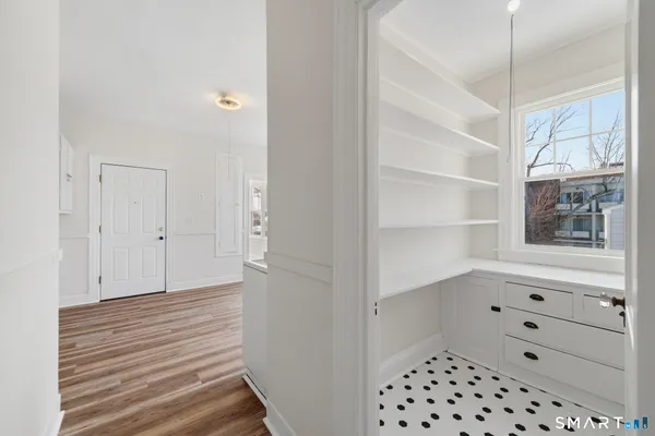 a view of a room that has a bed and a window