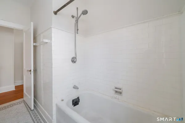 a view of an empty room with a window