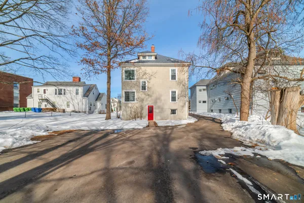 a view of a house with a snow in the yard
