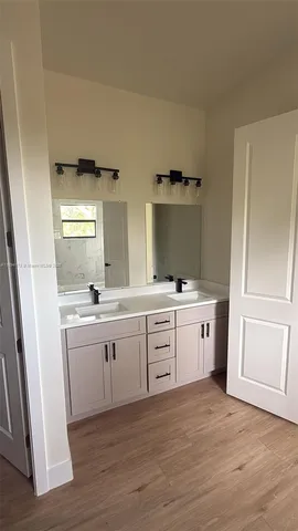 an empty room with an empty space and a ceiling fan