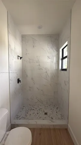 a bathroom with a double vanity sink and mirror