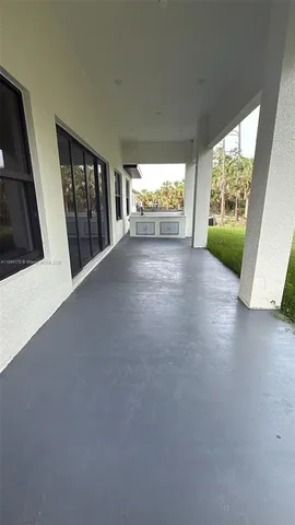 a view of an empty room and window