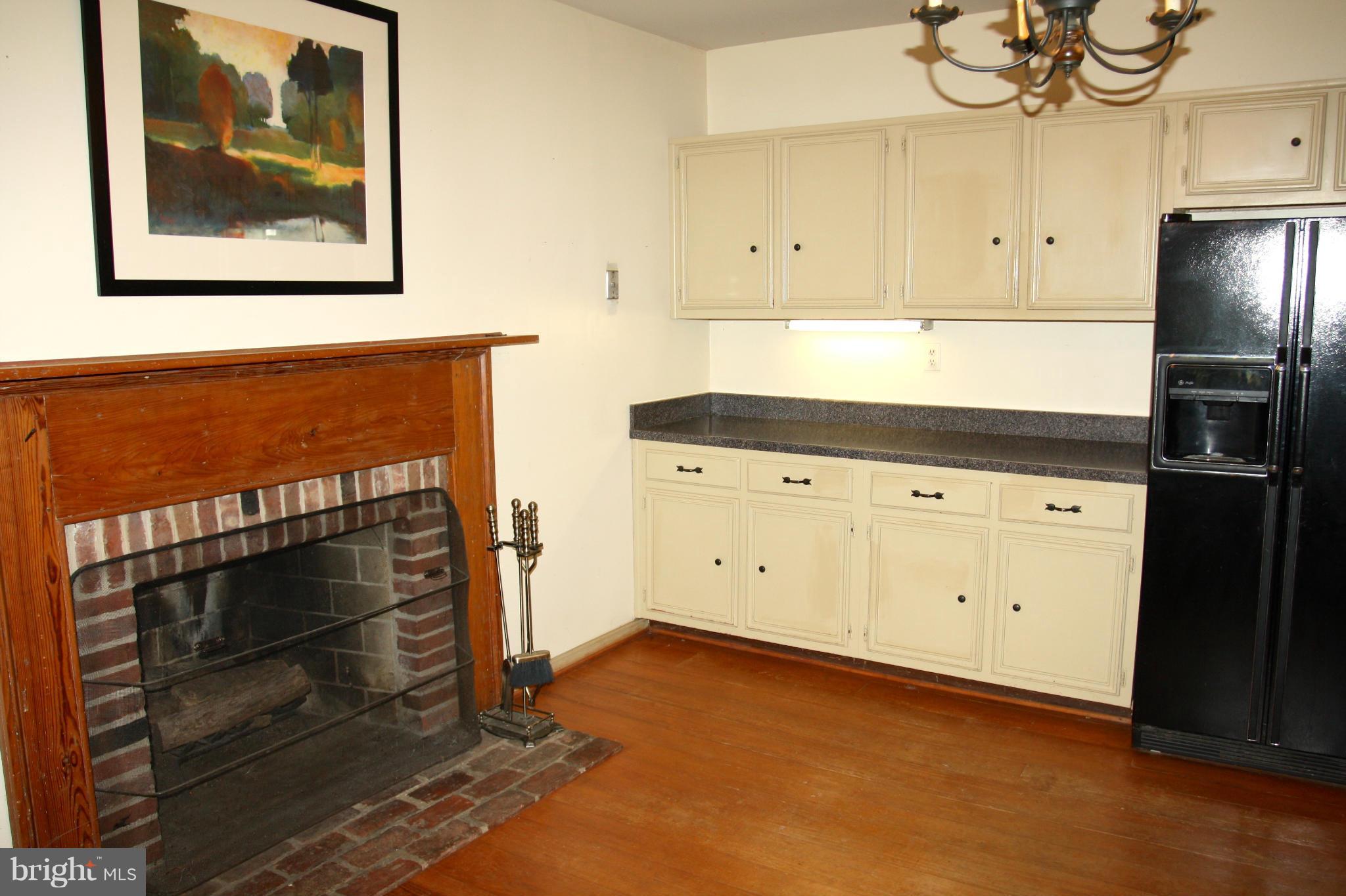 4000 Chaneyville Road Owings, MD 20736 - Photo 6 of 30 a kitchen with white cabinets and a stove