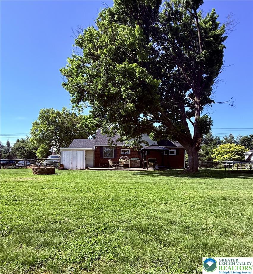 1275 Macada Road Bethlehem, PA 18017 - Photo 83 of 87 a view of a house with a yard and trees