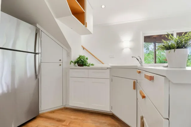 a view of a storage and utility room with washer and dryer