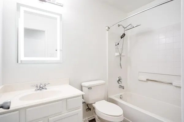 a bathroom with a sink a toilet and a bathtub