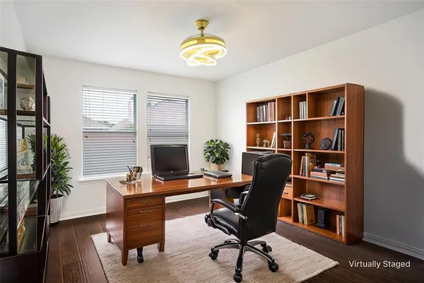 a workspace with furniture and a potted plant