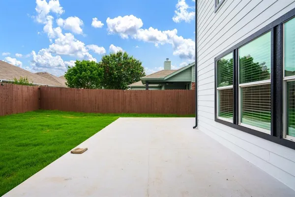 a view of a backyard with green space