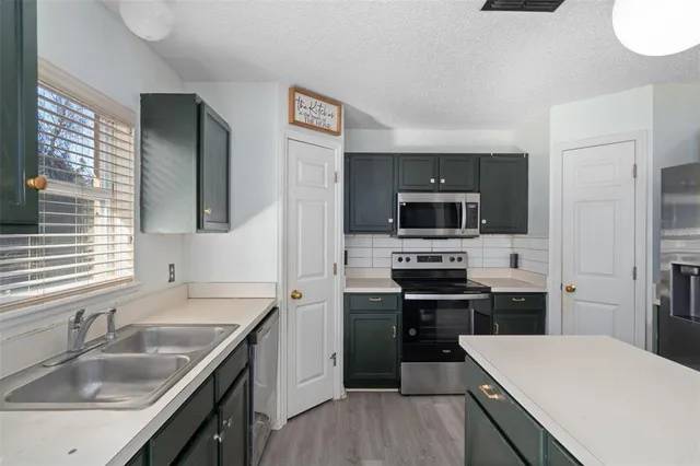a view of living room with granite countertop furniture and fireplace