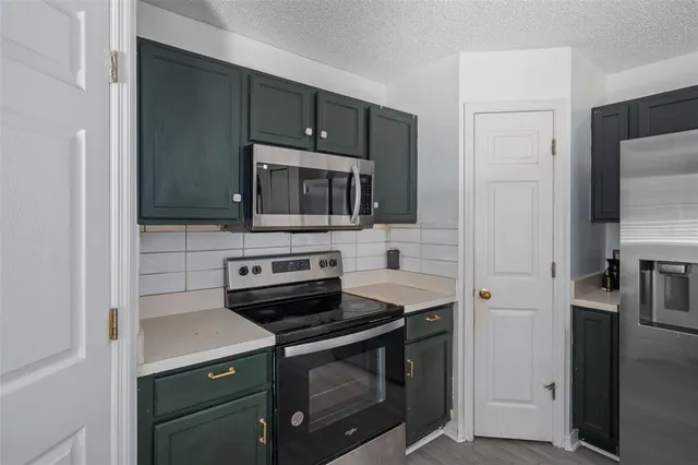 a view of a dining room with furniture a chandelier and wooden floor
