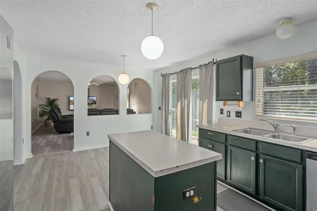a view of a dining room with furniture and window