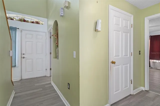 a room with a bed and a ceiling fan