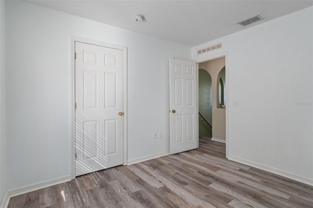 2359 Gimlet Avenue Spring Hill, FL 34608 - Photo 43 of 52 a view of an empty room with wooden floor