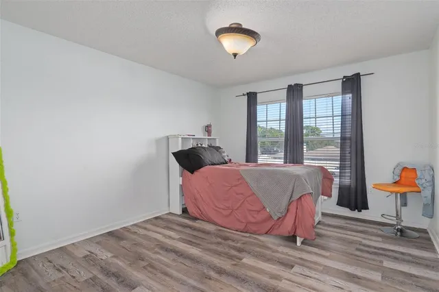 a backyard of a house with yard and outdoor seating