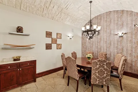 a kitchen with stainless steel appliances a sink stove and cabinets