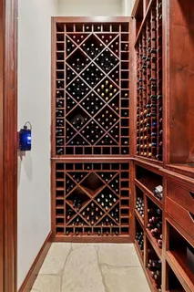 a kitchen with stainless steel appliances a sink a stove a refrigerator and cabinets