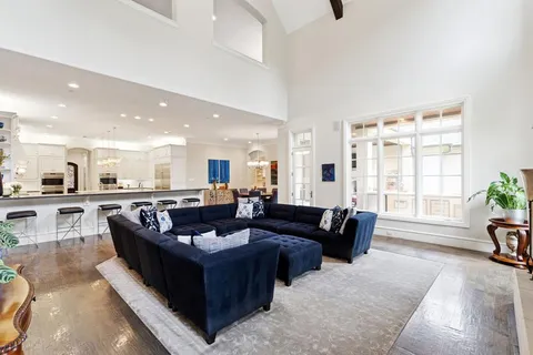 a living room with furniture a window and a fireplace