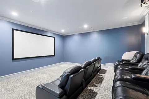 a bedroom with a bed and chandelier