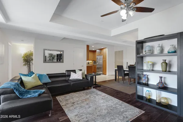 a living room with furniture and wooden floor