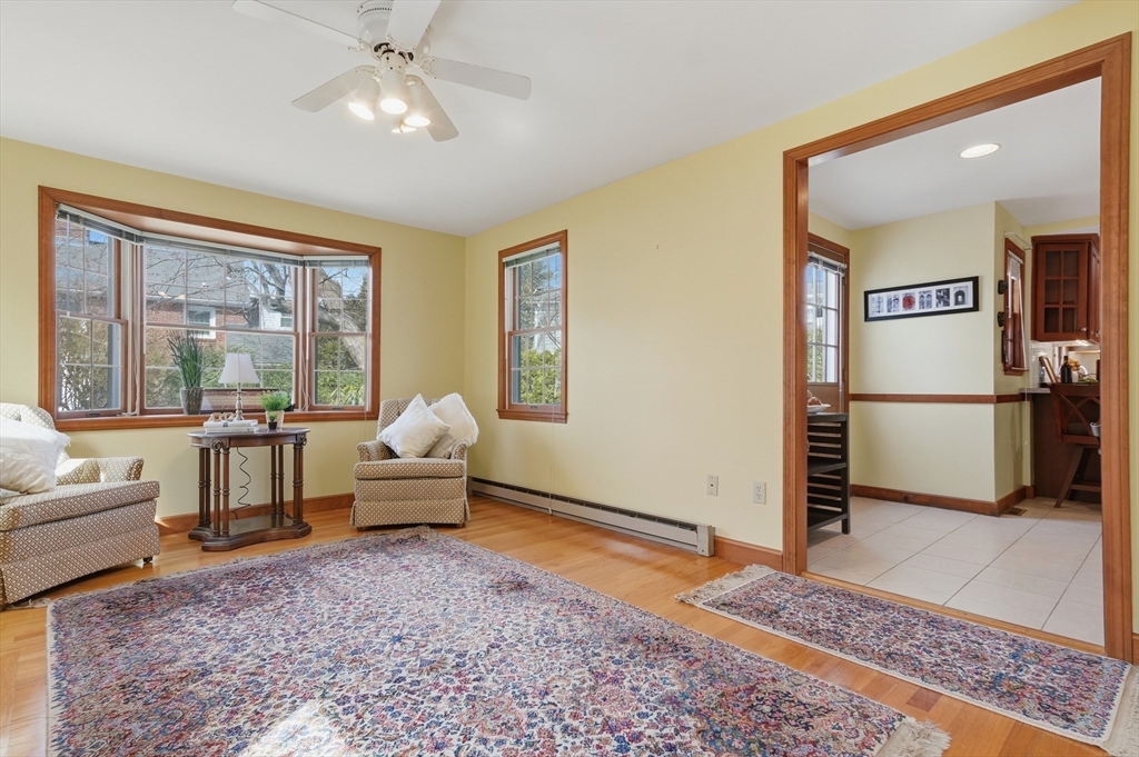 16 Cheswick Road Arlington, MA 02474 - Photo 16 of 35 a living room with furniture floor to ceiling window and a rug