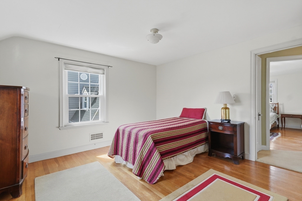 16 Cheswick Road Arlington, MA 02474 - Photo 22 of 35 a bedroom with a bed and wooden floor