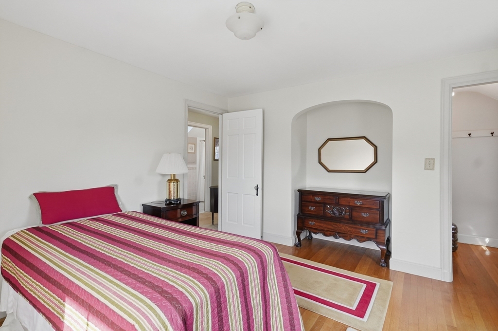 16 Cheswick Road Arlington, MA 02474 - Photo 23 of 35 a bedroom with bed and wooden floor