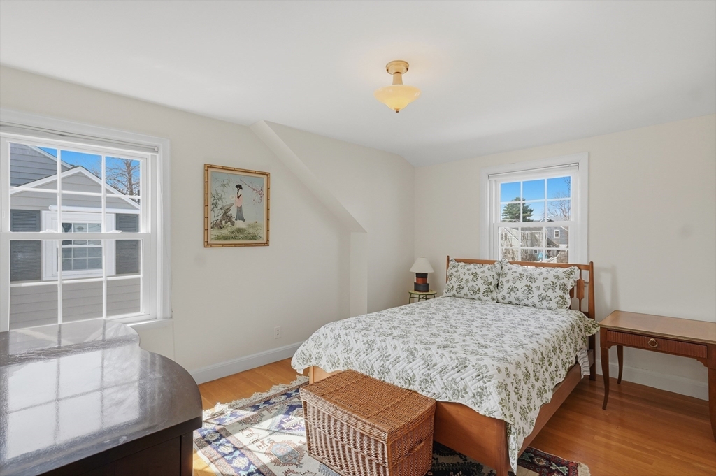 16 Cheswick Road Arlington, MA 02474 - Photo 24 of 35 a bedroom with a bed and wooden floor