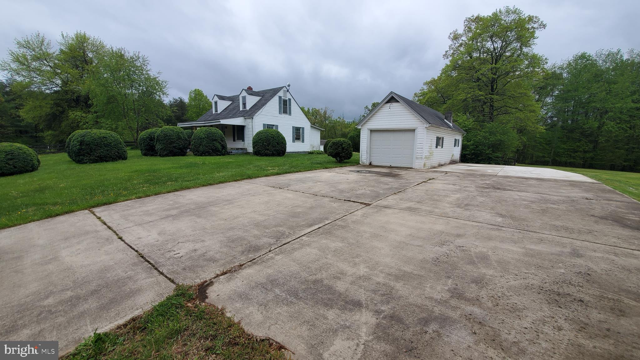 large driveway pad with garage