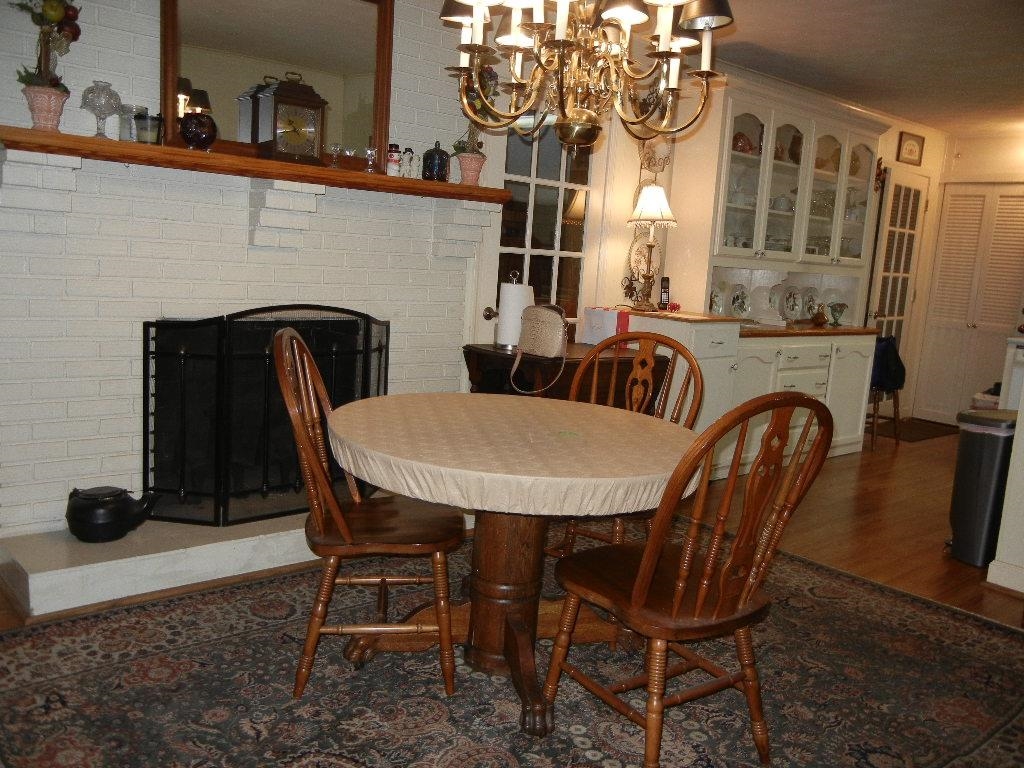 6469 Patmore Road Memphis, TN 38134 - Photo 12 of 27 Fireplace and Chandelier