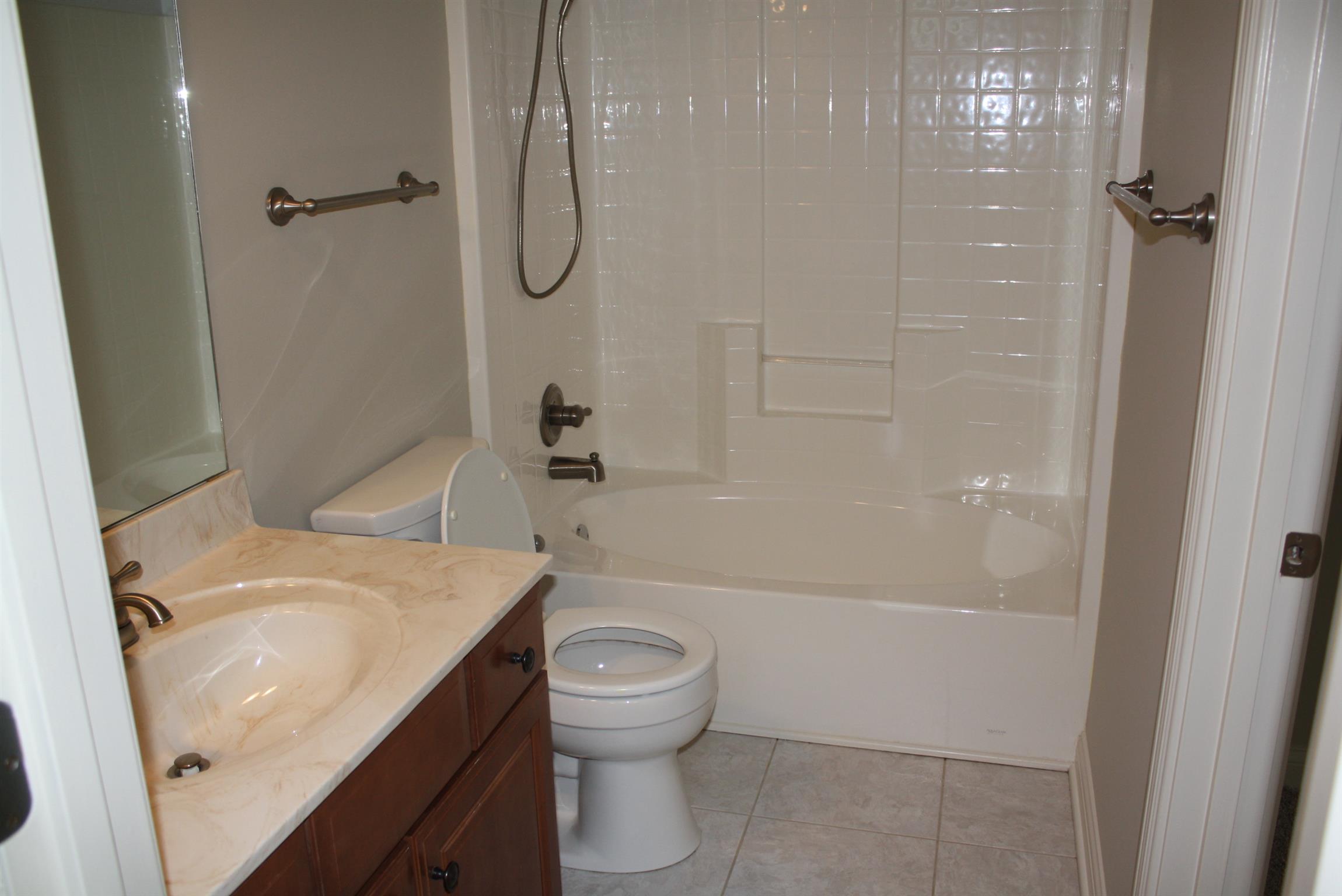 3620 Guthrie Road Clarksville, TN 37043 - Photo 20 of 30 a bathroom with a granite countertop sink toilet and shower
