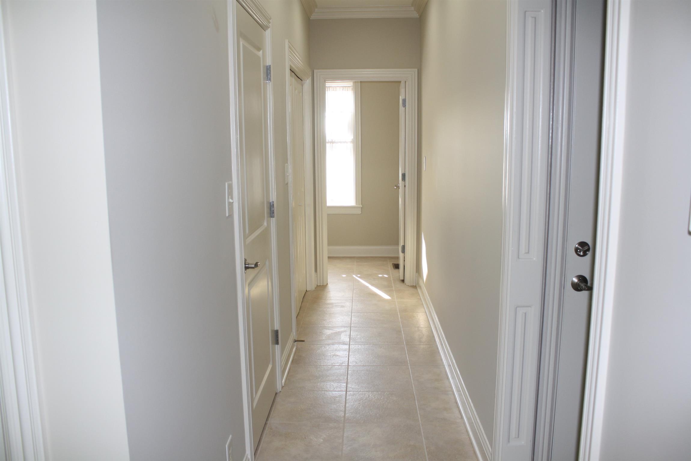 3620 Guthrie Road Clarksville, TN 37043 - Photo 21 of 30 a view of a hallway with a wooden cabinets