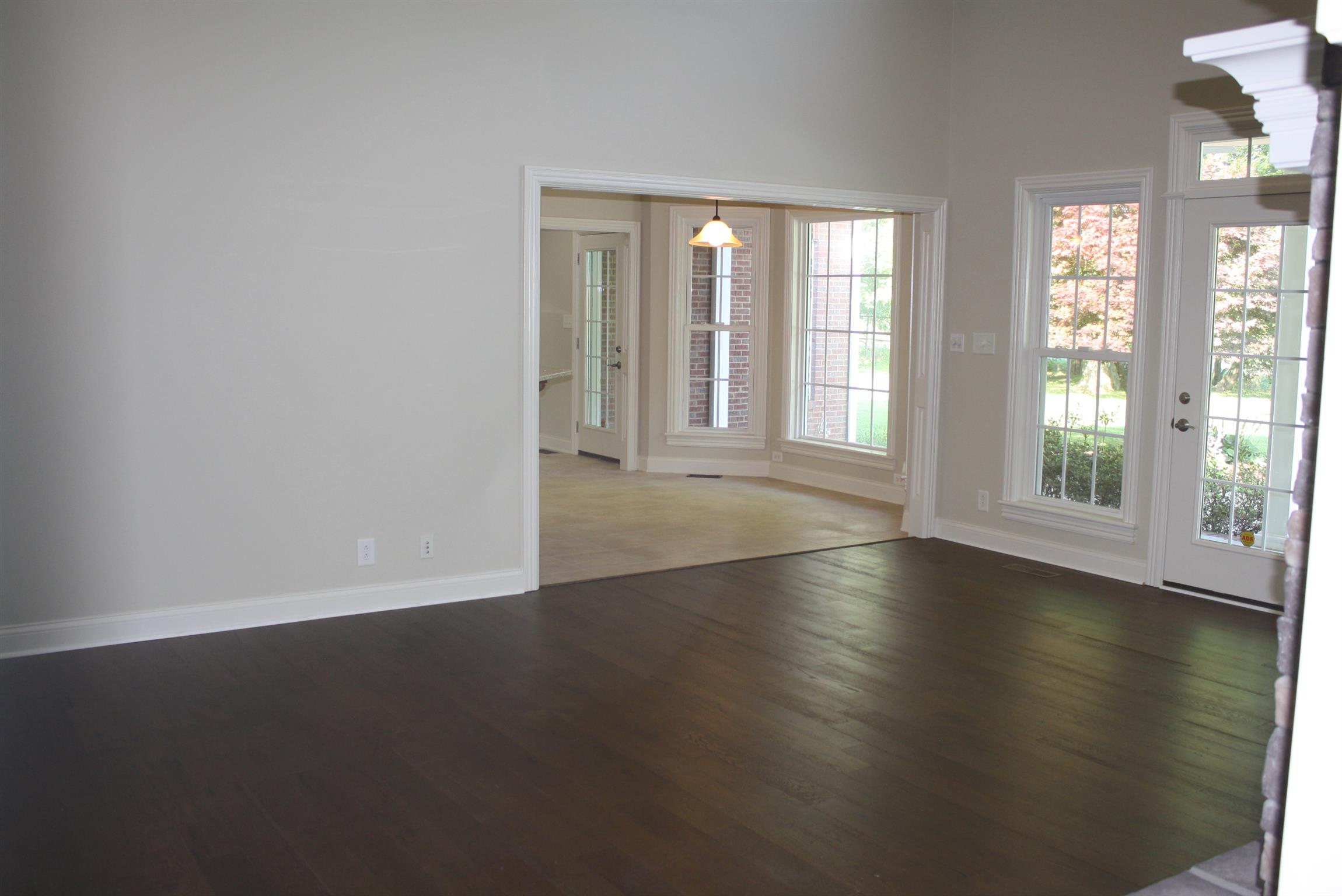 3620 Guthrie Road Clarksville, TN 37043 - Photo 6 of 30 an empty room with wooden floor and windows