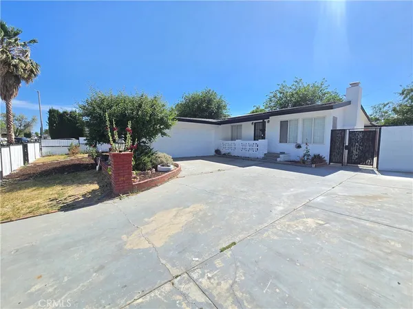 a view of a backyard with a sitting area