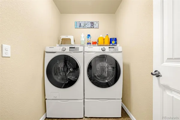 a utility room with dryer and washer
