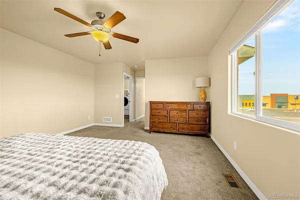 a bedroom with a bed and a dresser