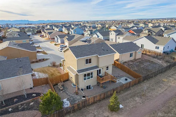 an aerial view of residential houses with outdoor space