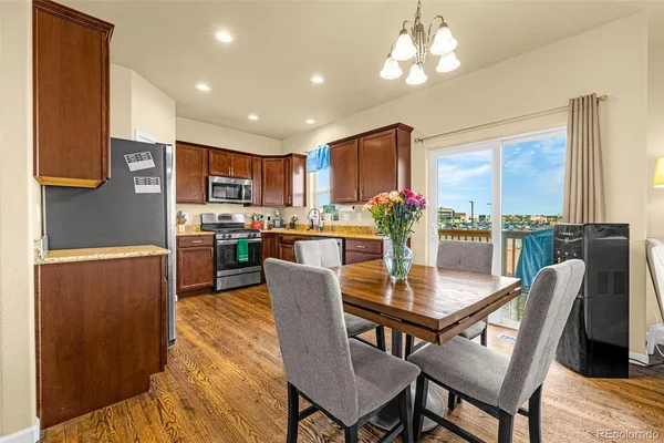 a view of a dining room with furniture window and wooden floor