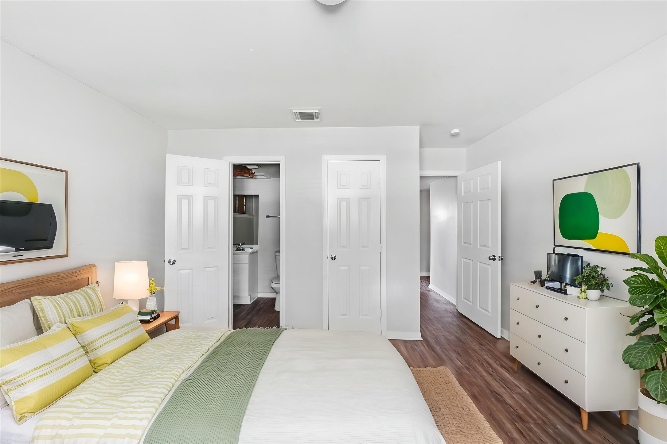 6410 Hopper Road Houston, TX 77016 - Photo 6 of 28 a bedroom with a bed and flat screen tv