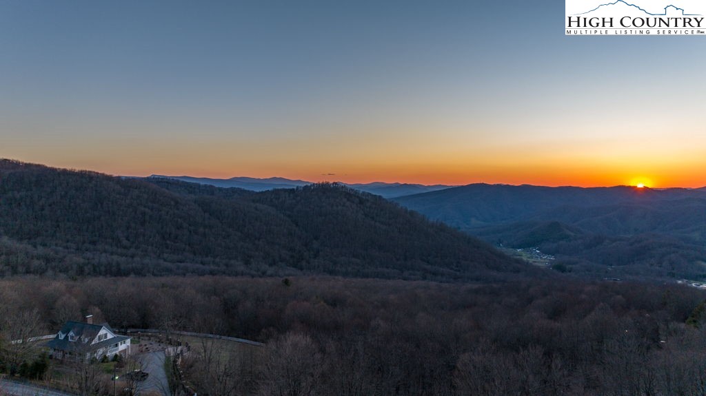 C105 Acorn Nvno Road Zionville, NC 28698 - Photo 16 of 35 a view of a lake with a mountain in the background