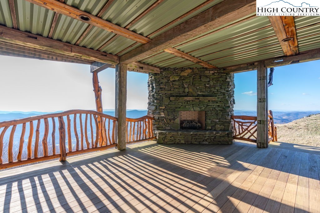 C105 Acorn Nvno Road Zionville, NC 28698 - Photo 23 of 35 a view of a porch with wooden floor and fence