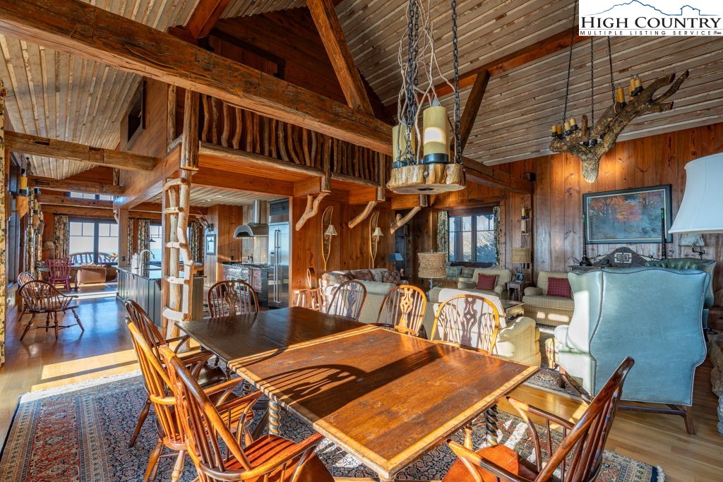 C105 Acorn Nvno Road Zionville, NC 28698 - Photo 32 of 35 a view of a patio with table and chairs with wooden floor