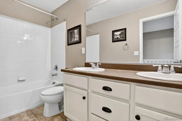 an empty room with a ceiling fan and a window