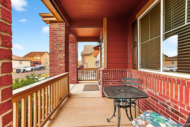 a view of a balcony with a potted plant