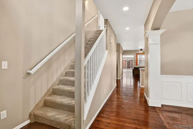 a living room with furniture wooden floor and a fireplace