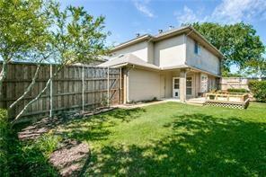 544 Lake Forest Drive Coppell, TX 75019 - Photo 1 of 24 a view of a white house with a big yard and large trees