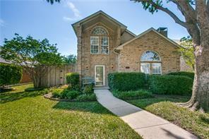 544 Lake Forest Drive Coppell, TX 75019 - Photo 2 of 24 a front view of a house with garden
