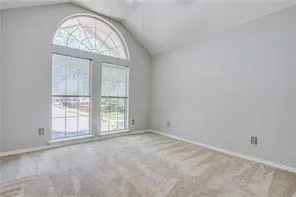 an empty room with a large window