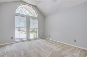 544 Lake Forest Drive Coppell, TX 75019 - Photo 21 of 24 an empty room with a large window