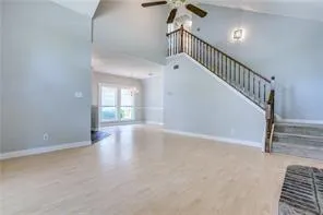 a view of an entryway with wooden floor